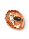 Wooden strawberrytray with a keychain and car key on a white background