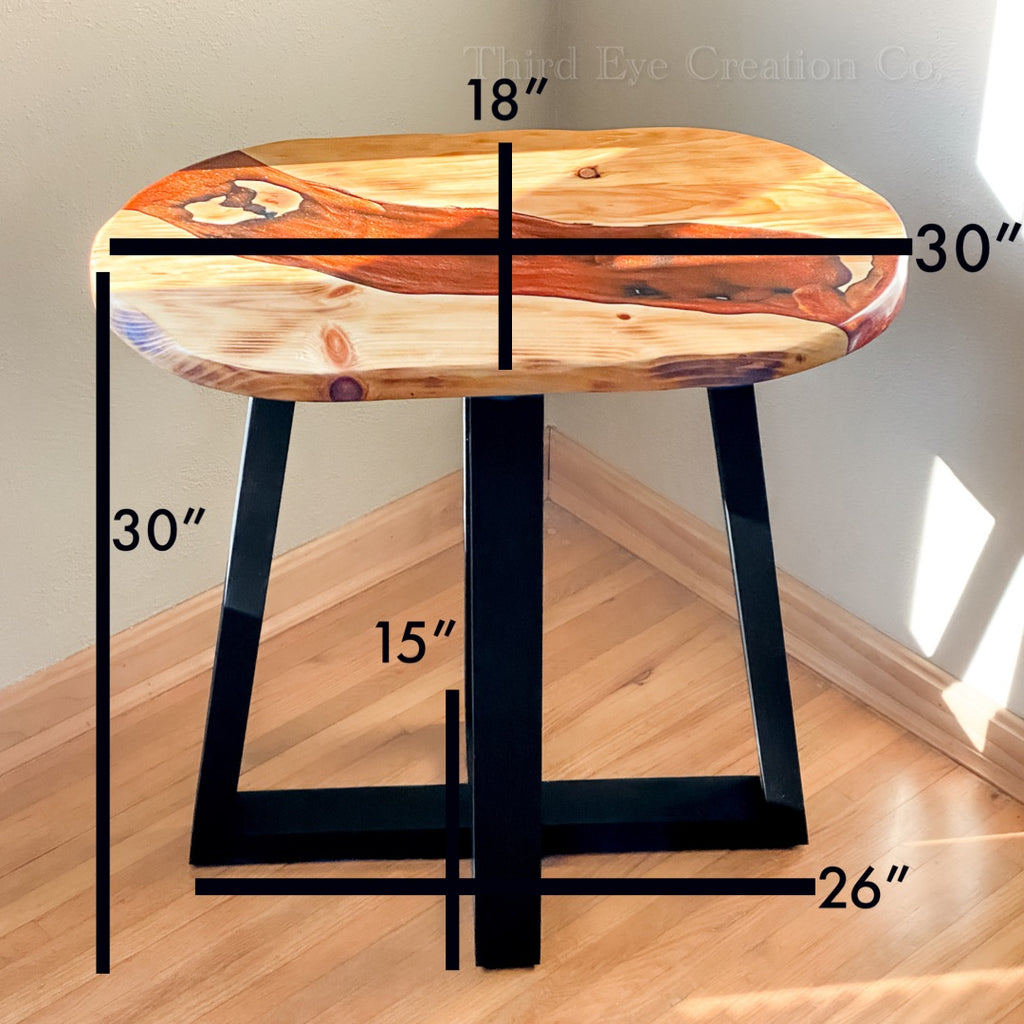 A live-edge wood table with a black metal pedestal base, shown in a room corner with overlaid dimension lines and measurements (18, 30, 30, 15, 26 inches).